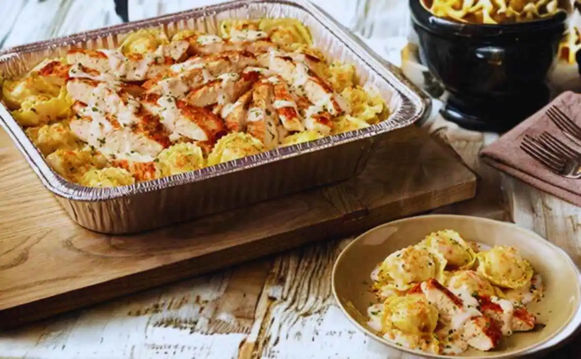 Olive Garden family-size Chicken Tortelloni Alfredo tray with cheese-filled tortelloni, grilled chicken, and creamy Alfredo sauce