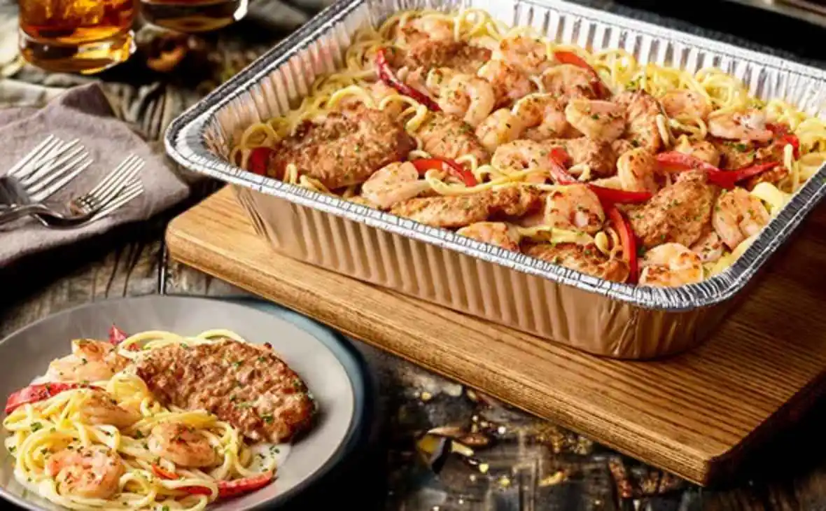 Olive Garden family-size Chicken and Shrimp Carbonara tray with pasta, grilled chicken, shrimp, and peppers