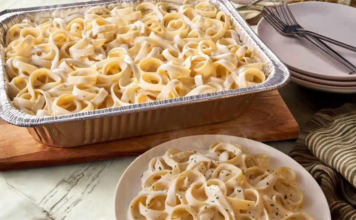 Olive Garden family-size Fettuccine Alfredo tray with creamy Alfredo sauce