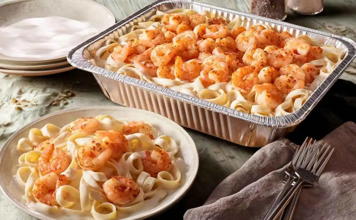 Olive Garden family-size Shrimp Alfredo tray with creamy Alfredo sauce and seasoned shrimp