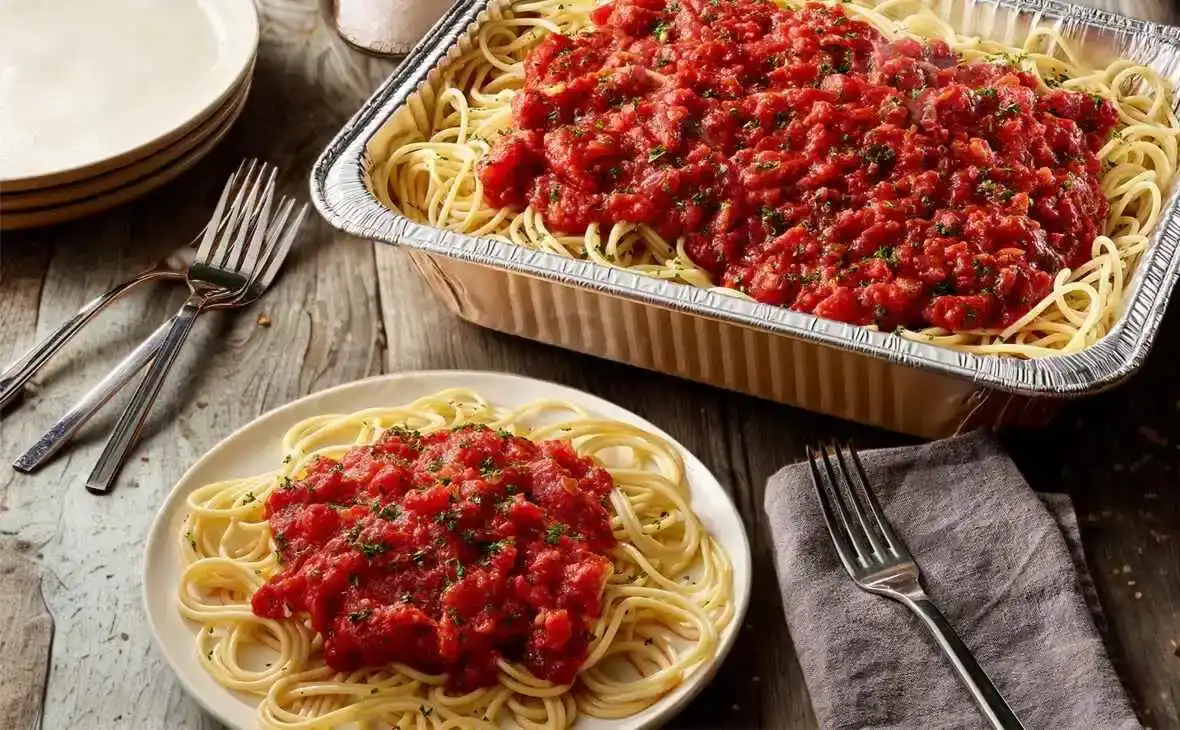 Olive Garden family-size Spaghetti with marinara sauce tray topped with classic tomato sauce