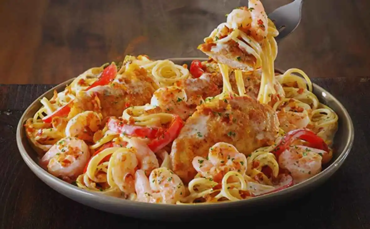 Olive Garden Chicken and Shrimp Carbonara with creamy parmesan sauce, grilled chicken, shrimp, and bacon