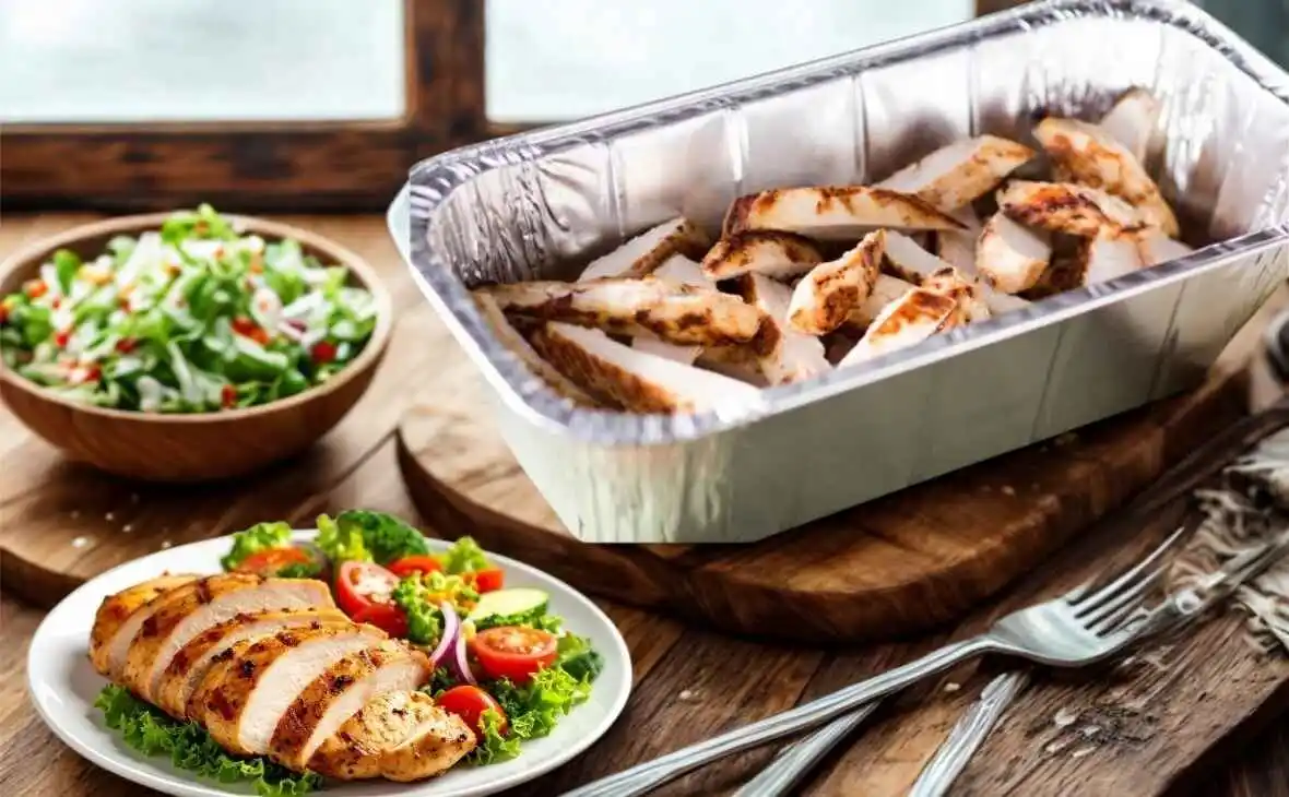 Grilled chicken breast slices in catering tray serves 4 to 6
