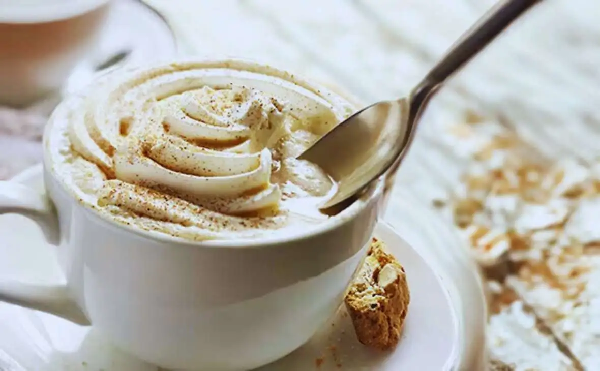 Hot cappuccino coffee with creamy milk foam in a cup