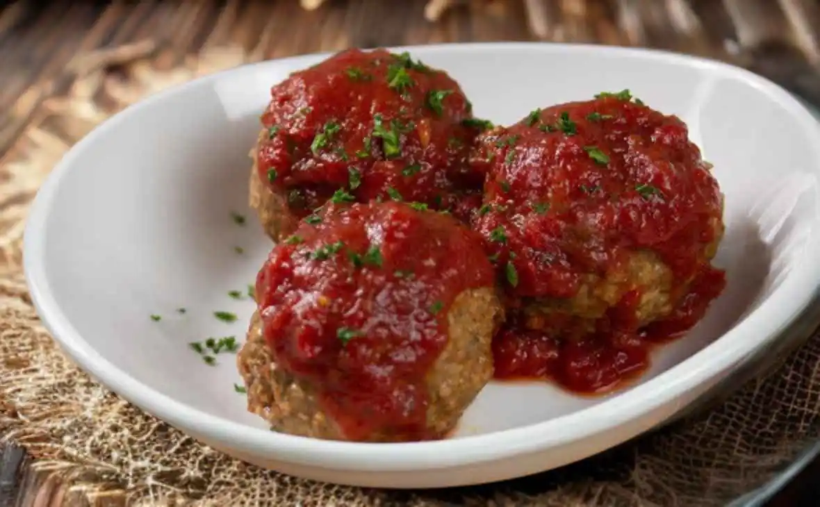 Olive Garden side of meatballs served with rich marinara sauce