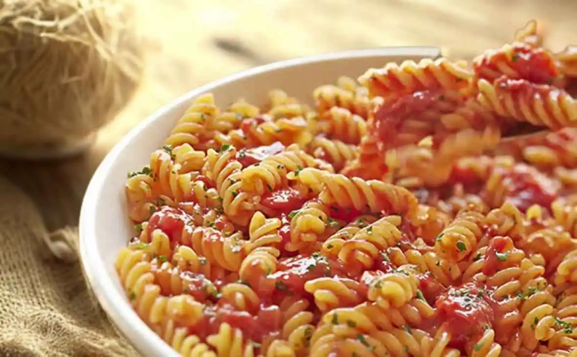 Rotini pasta with marinara tomato sauce in a bowl