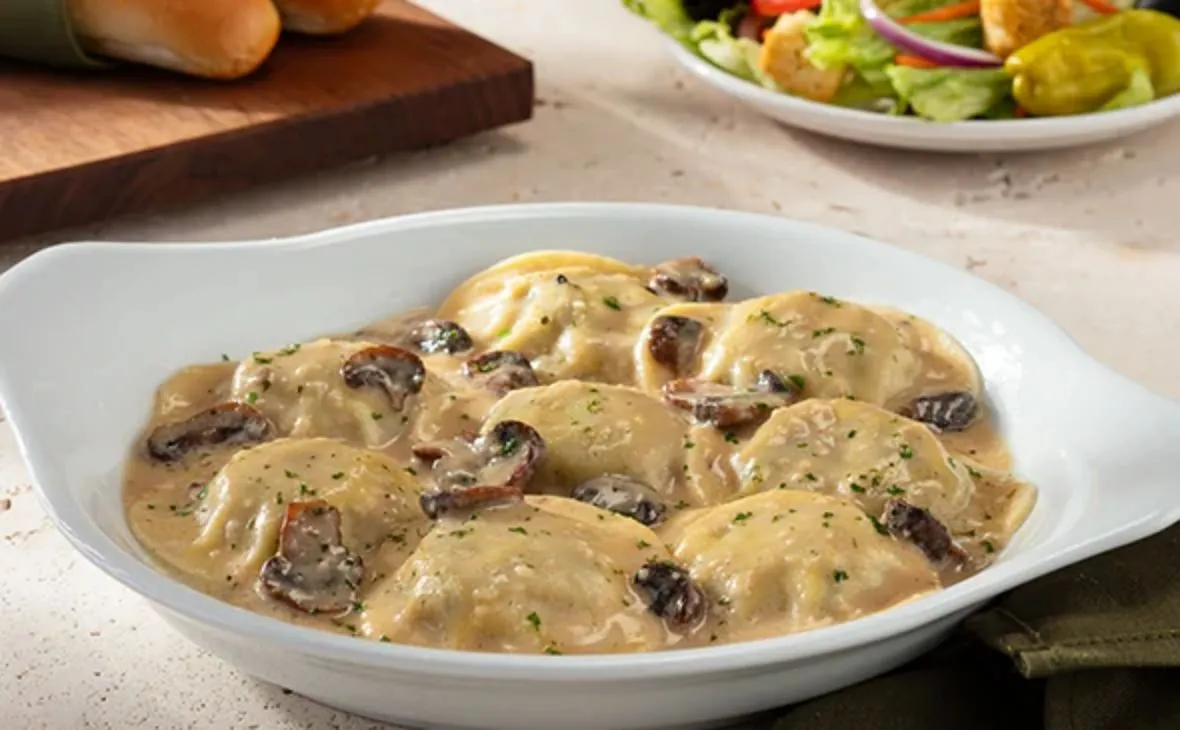 Dinner Menu 13 Creamy Mushroom Ravioli from the Olive Garden dinner menu served in a rich creamy mushroom sauce.